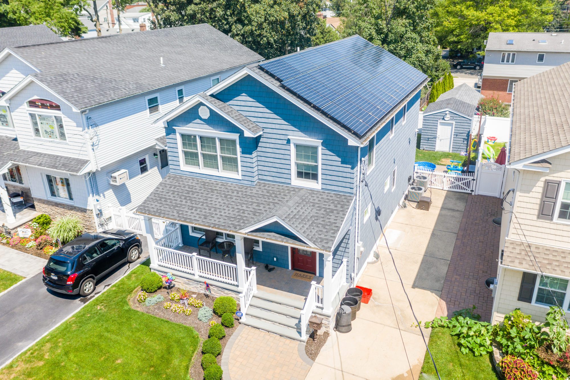 Solar panels attatched to this house on LOng Island enable to homeowners to use solar energy to power their home. The cost of solar is fixed, allowing the homeowners to increase their savings.