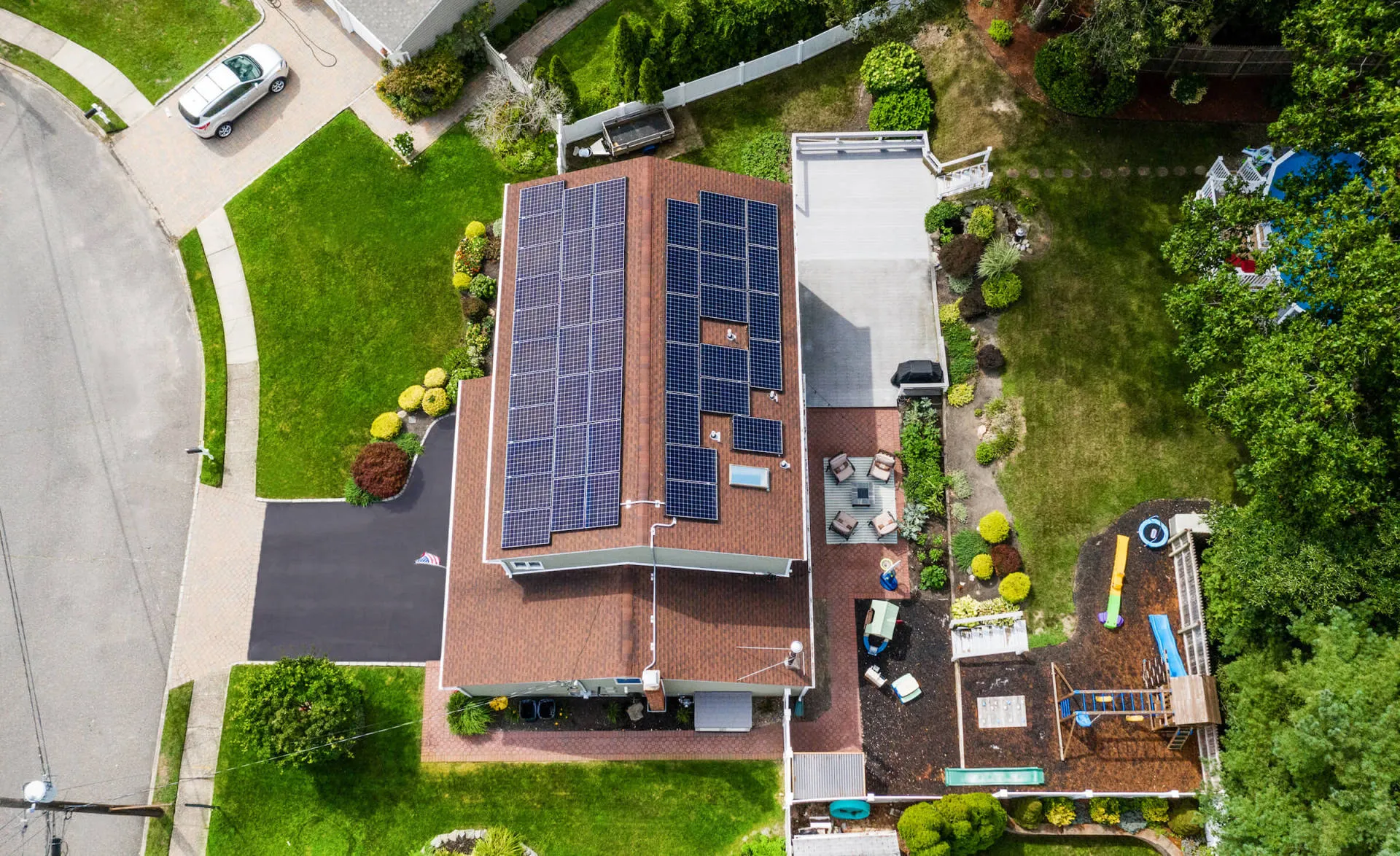 A house on Long Island has a number of solar panels on the roof.