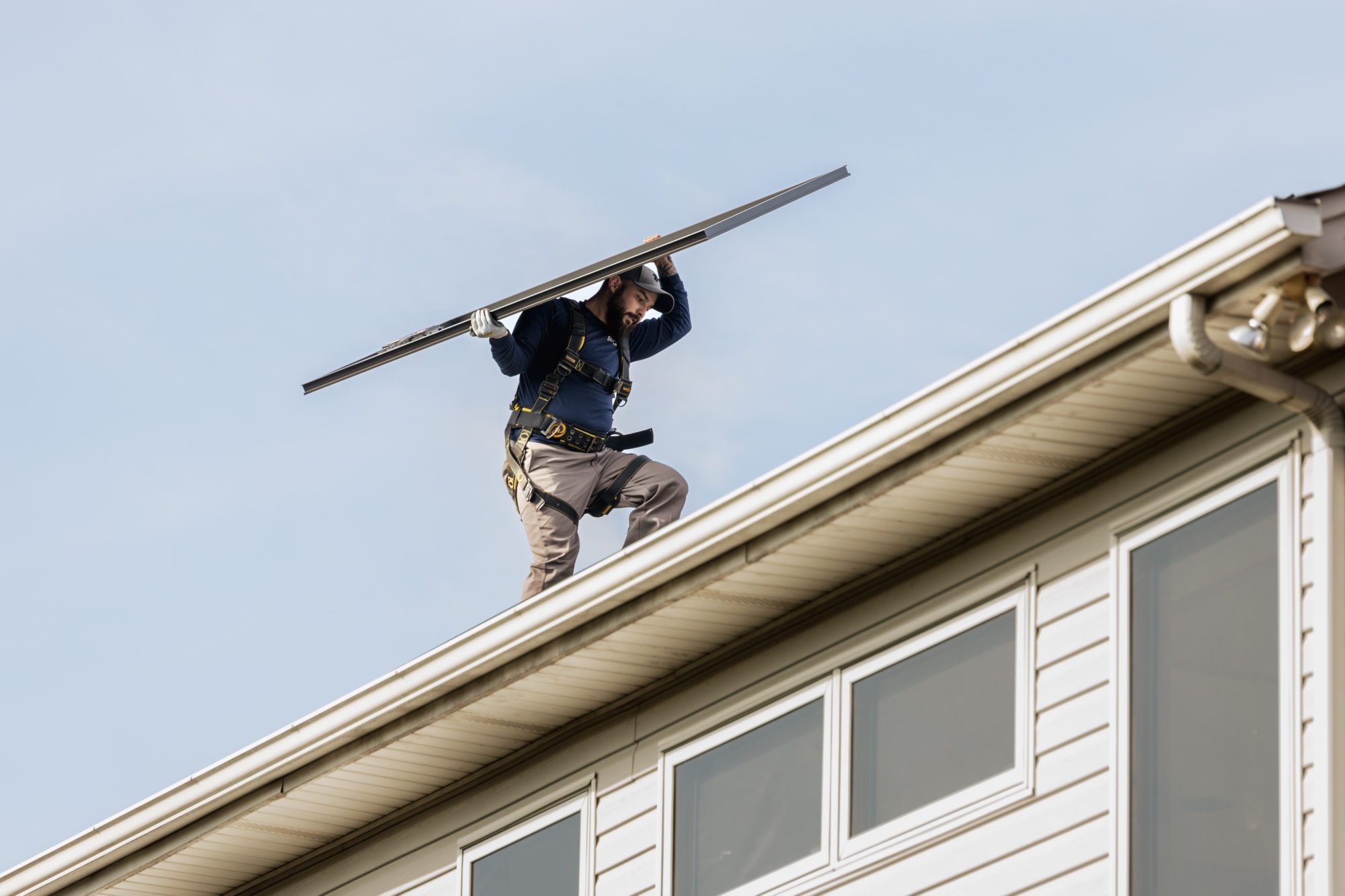 EmPower Solar installer working on rooftop
