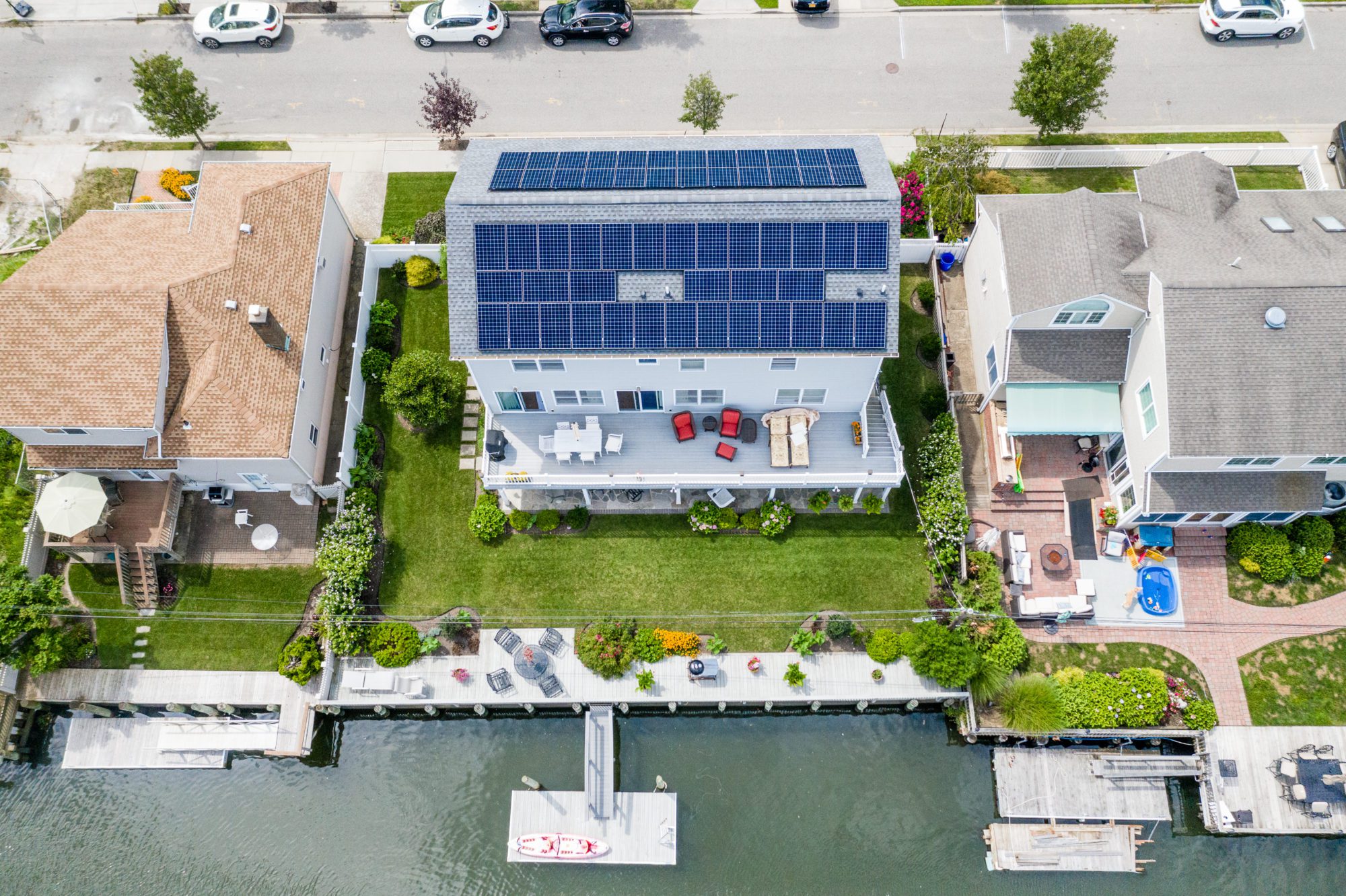 A waterfront house on Long Island has solar panels on the roof to generate clean energy.