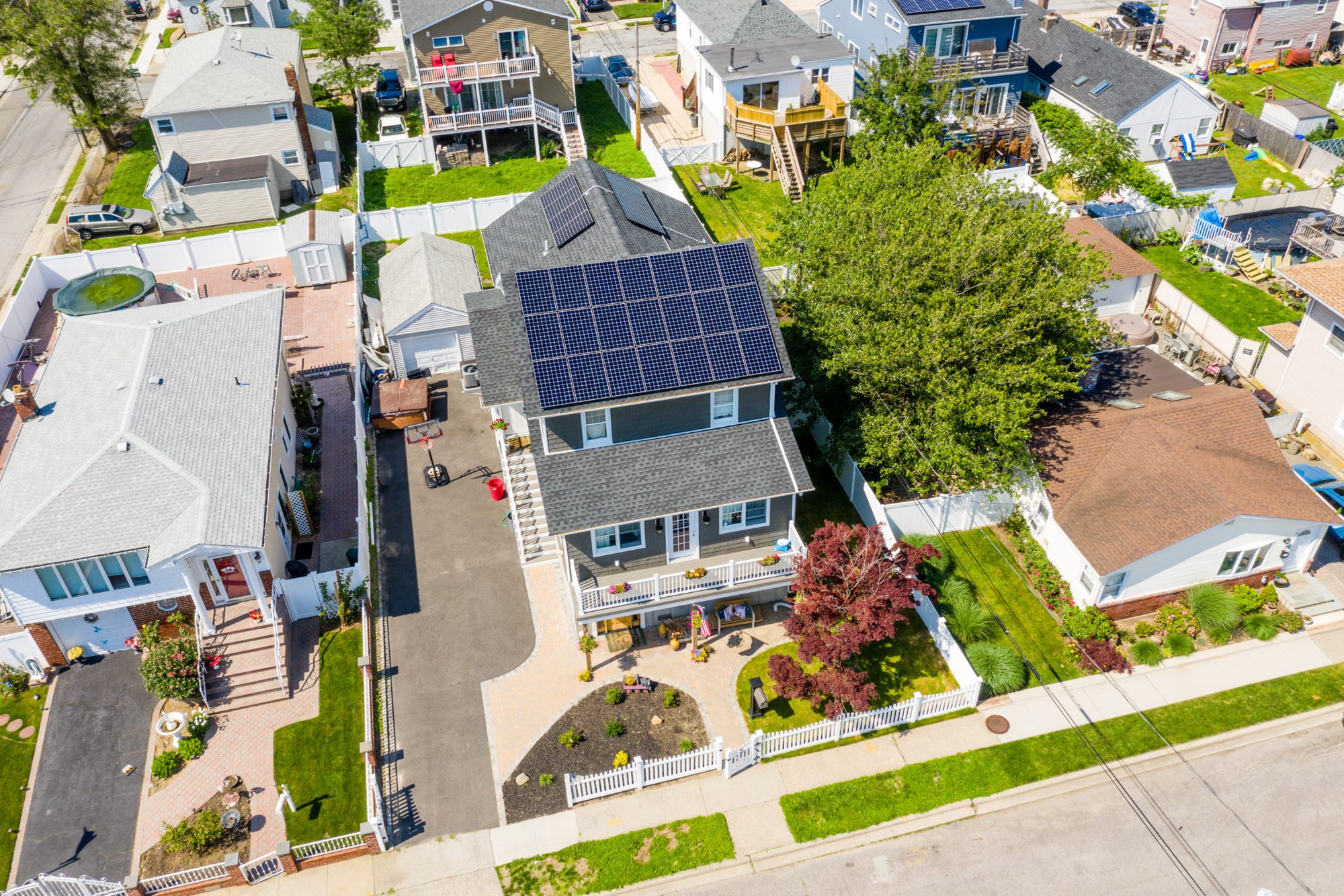 A house on Long Island has solar panels attached to the roof.