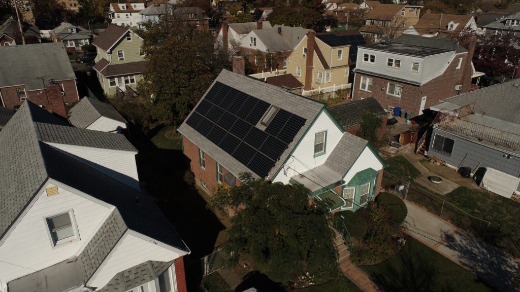 A home in NYC has solar panels to help reduce costs. 